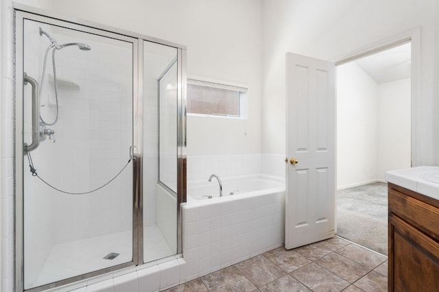 10643 N Tea Party Ln, Fresno, CA 93730 - full bath featuring a bath, a stall shower, vanity, and tile patterned floors