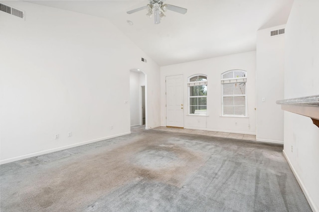 10643 N Tea Party Ln, Fresno, CA 93730 - unfurnished living room featuring arched walkways, ceiling fan, carpet flooring, and high vaulted ceiling