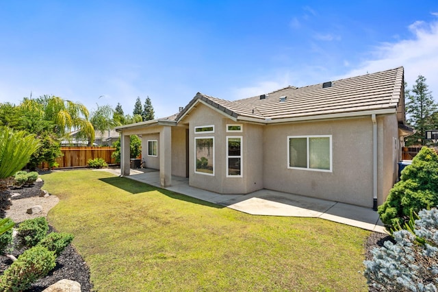 10643 N Tea Party Ln, Fresno, CA 93730 - back of house with stucco siding, a patio, and a tile roof