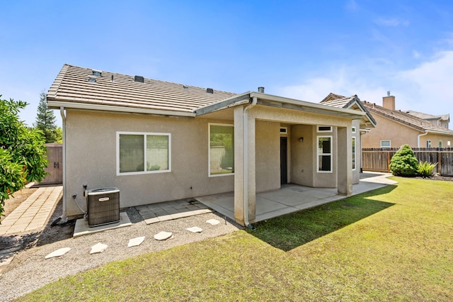 10643 N Tea Party Ln, Fresno, CA 93730 - rear view of property with stucco siding and a patio area