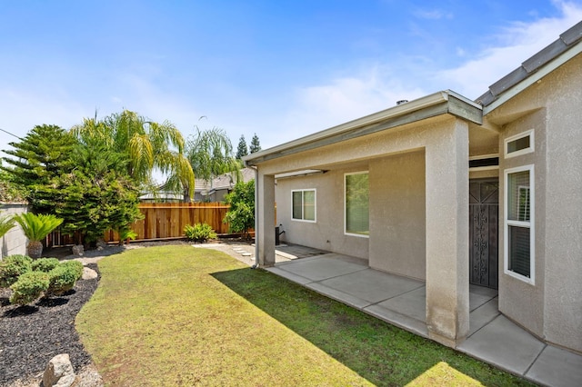 10643 N Tea Party Ln, Fresno, CA 93730 - fenced backyard with a patio