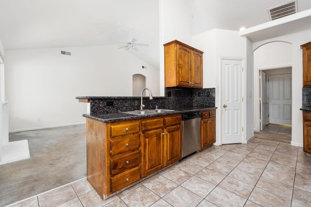 10643 N Tea Party Ln, Fresno, CA 93730 - kitchen with stainless steel dishwasher, a ceiling fan, light tile patterned floors, high vaulted ceiling, and backsplash