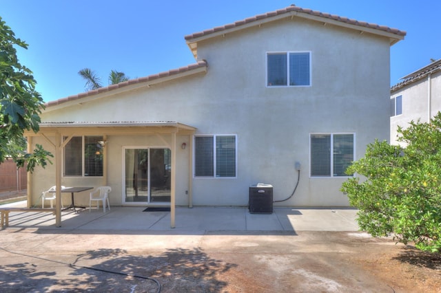 2062 Dunbar Way, Dinuba, CA 93618 - back of property featuring stucco siding, a patio area, and a tiled roof