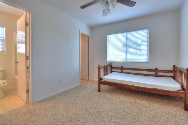 2062 Dunbar Way, Dinuba, CA 93618 - carpeted bedroom with connected bathroom and a ceiling fan