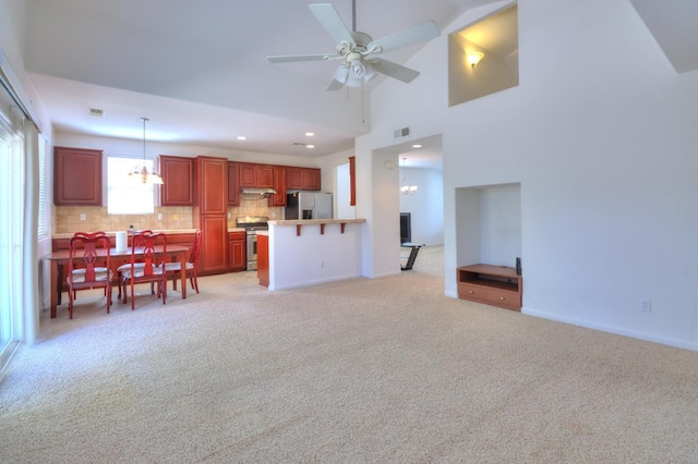 2062 Dunbar Way, Dinuba, CA 93618 - living area with light colored carpet, a chandelier, recessed lighting, and ceiling fan