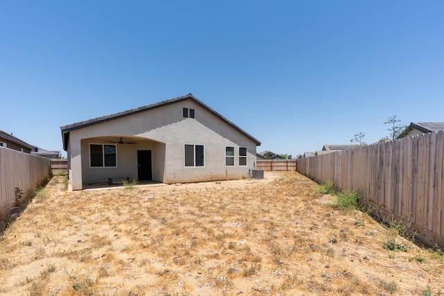 1160 Summit Ct, Madera, CA 93638 - rear view of house featuring a ceiling fan, stucco siding, a fenced backyard, and a patio
