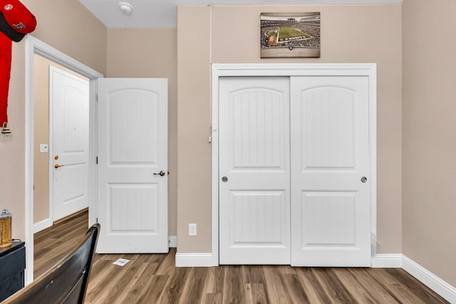 1160 Summit Ct, Madera, CA 93638 - unfurnished bedroom with wood finished floors and a closet