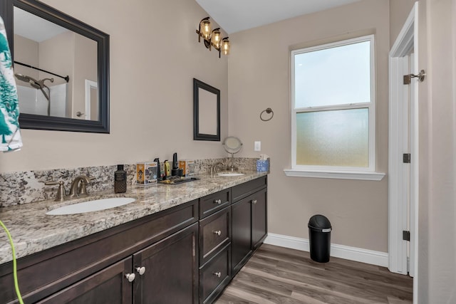 1160 Summit Ct, Madera, CA 93638 - bathroom with double vanity and wood finished floors