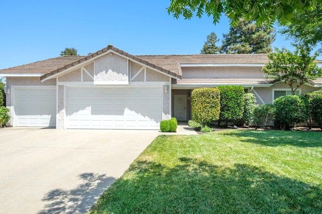 841 Whittier Ave, Clovis, CA 93611 - view of front of property with an attached garage, stucco siding, concrete driveway, and a front yard