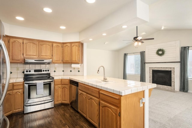 841 Whittier Ave, Clovis, CA 93611 - kitchen featuring appliances with stainless steel finishes, a peninsula, under cabinet range hood, recessed lighting, and open floor plan