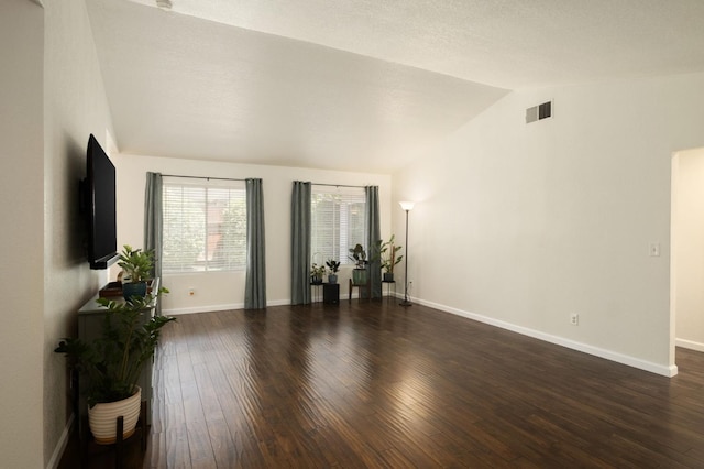 841 Whittier Ave, Clovis, CA 93611 - living area with vaulted ceiling and dark wood-style flooring