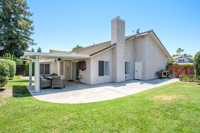 841 Whittier Ave, Clovis, CA 93611 - back of house featuring a ceiling fan, a chimney, a patio area, and stucco siding