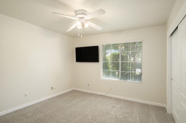 841 Whittier Ave, Clovis, CA 93611 - unfurnished bedroom featuring a closet, light carpet, and a ceiling fan