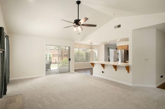 841 Whittier Ave, Clovis, CA 93611 - unfurnished living room with ceiling fan, carpet, high vaulted ceiling, and recessed lighting