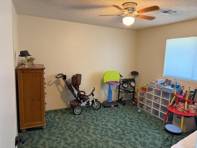 605 E Davis Dr, Dinuba, CA 93618 - recreation room featuring a ceiling fan, carpet flooring, and a textured ceiling
