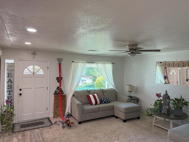 605 E Davis Dr, Dinuba, CA 93618 - living room featuring a ceiling fan, plenty of natural light, a textured ceiling, and recessed lighting
