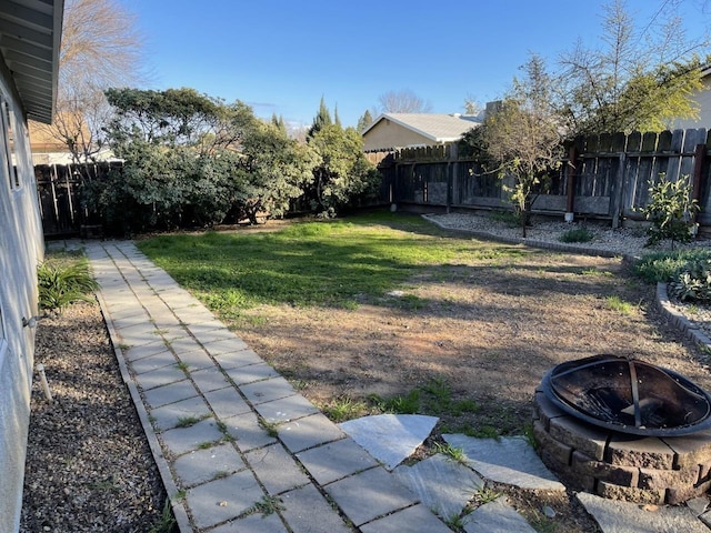 1468 Browning Ave, Clovis, CA 93611 - fenced backyard featuring a fire pit