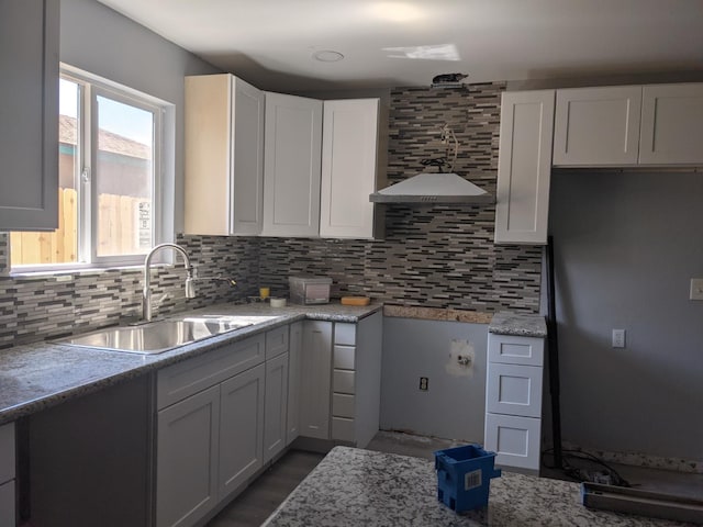 1468 Browning Ave, Clovis, CA 93611 - kitchen featuring decorative backsplash, white cabinetry, and light stone countertops