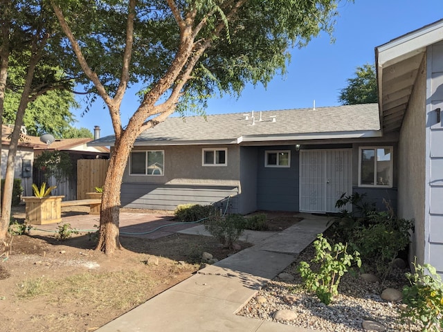 1468 Browning Ave, Clovis, CA 93611 - rear view of property with roof with shingles and stucco siding