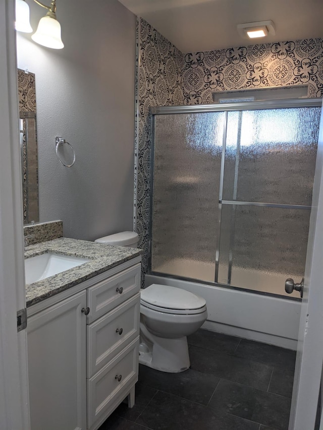1468 Browning Ave, Clovis, CA 93611 - bathroom with vanity, bath / shower combo with glass door, and tile patterned floors