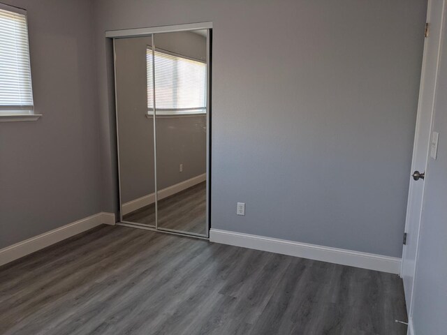 1468 Browning Ave, Clovis, CA 93611 - unfurnished bedroom with a closet and dark wood-style floors