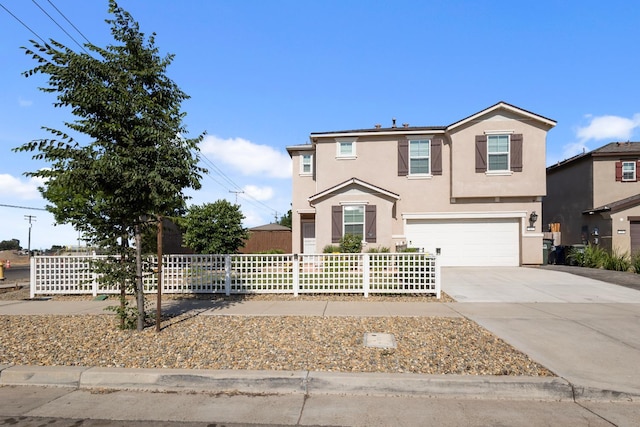 17 Medieval, Merced, CA 95341 - traditional home with stucco siding, an attached garage, and driveway