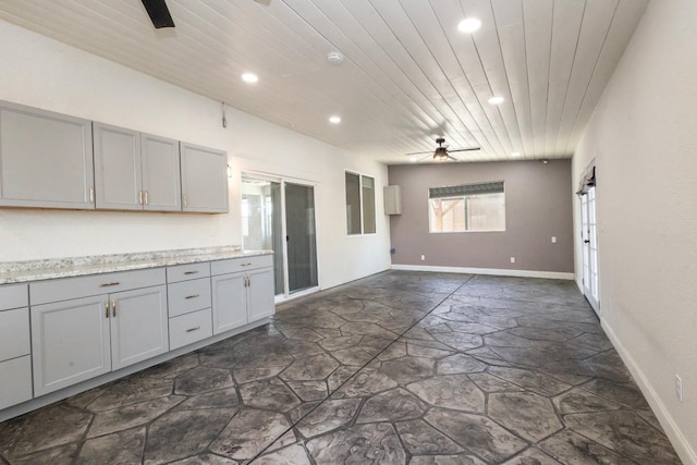 17 Medieval, Merced, CA 95341 - kitchen featuring stone flooring, recessed lighting, gray cabinets, ceiling fan, and light countertops