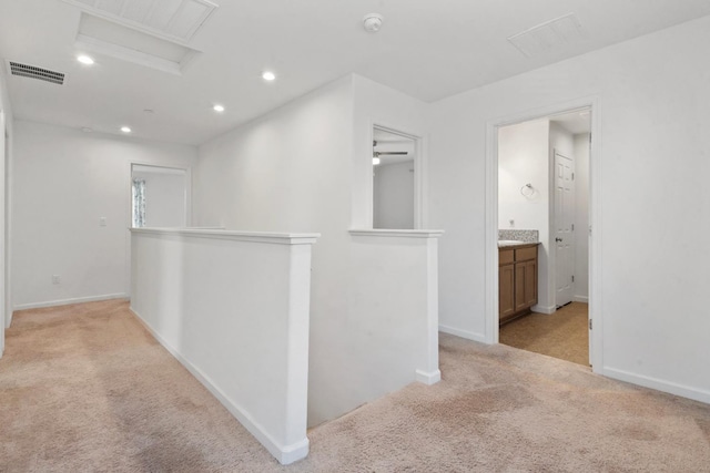 17 Medieval, Merced, CA 95341 - hallway featuring an upstairs landing, light colored carpet, attic access, and recessed lighting