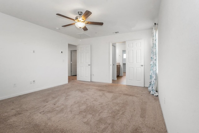 17 Medieval, Merced, CA 95341 - unfurnished bedroom featuring light carpet, ceiling fan, and connected bathroom