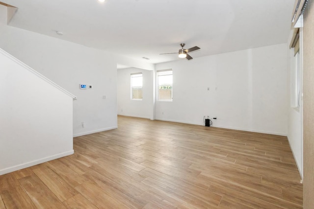 17 Medieval, Merced, CA 95341 - unfurnished living room with ceiling fan and light wood-style floors
