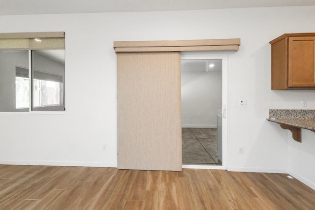 17 Medieval, Merced, CA 95341 - unfurnished dining area with light wood-type flooring