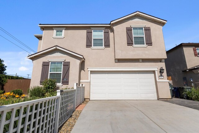 17 Medieval, Merced, CA 95341 - traditional home featuring an attached garage, stucco siding, and concrete driveway