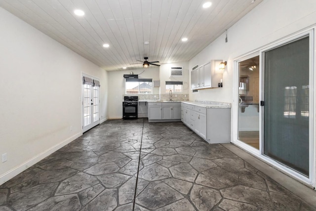 17 Medieval, Merced, CA 95341 - kitchen featuring black gas range oven, recessed lighting, stone floors, wood ceiling, and a ceiling fan