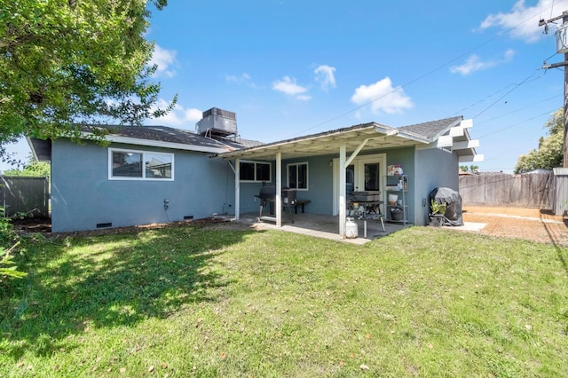 42 W Rall Ave, Clovis, CA 93612 - rear view of house with stucco siding, a patio area, and crawl space