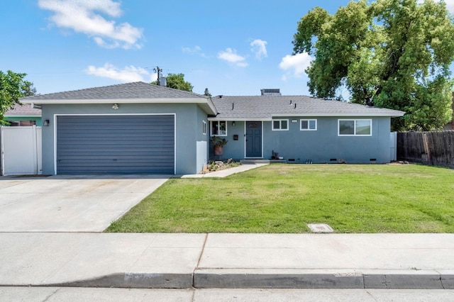 42 W Rall Ave, Clovis, CA 93612 - ranch-style house featuring an attached garage, stucco siding, and driveway