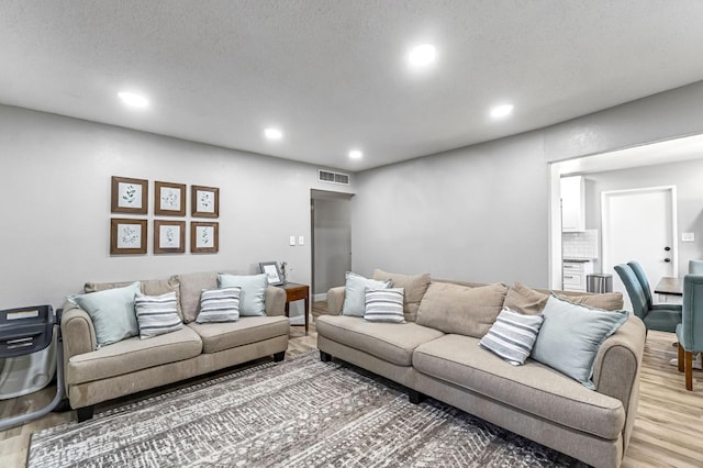 42 W Rall Ave, Clovis, CA 93612 - living area with light wood-type flooring and recessed lighting
