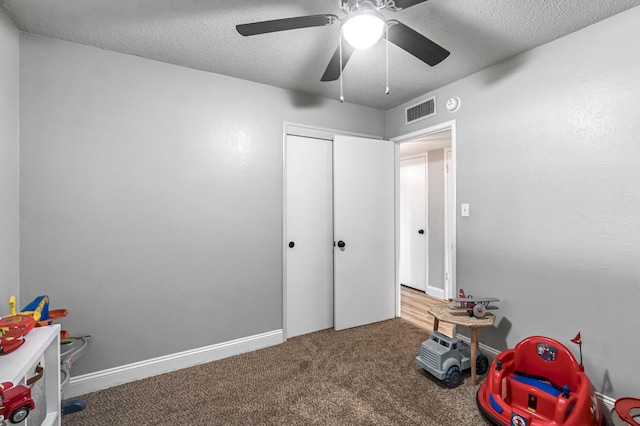 42 W Rall Ave, Clovis, CA 93612 - playroom featuring a textured ceiling, a ceiling fan, and carpet
