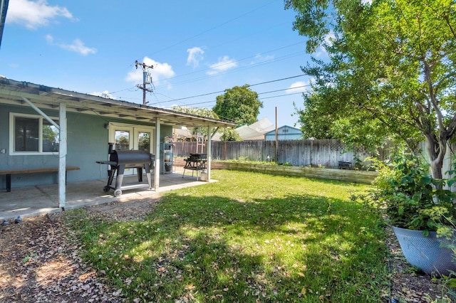 42 W Rall Ave, Clovis, CA 93612 - fenced backyard with a patio area