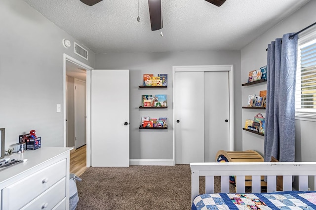 42 W Rall Ave, Clovis, CA 93612 - bedroom with a closet, light carpet, a ceiling fan, and a textured ceiling