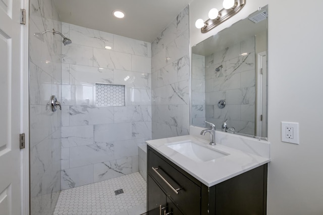 17189 Iona Ave, Lemoore, CA 93245 - bathroom with tiled shower, vanity, and recessed lighting