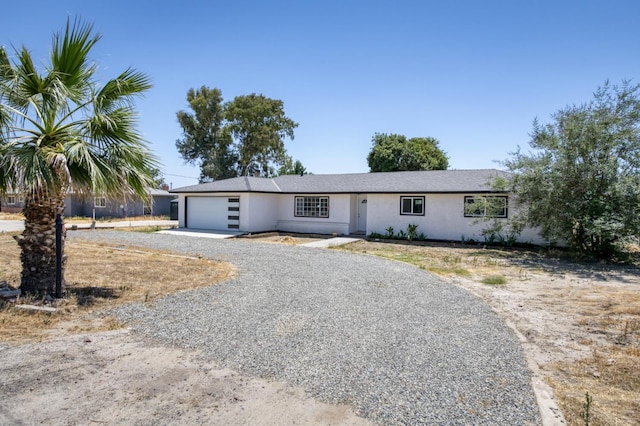 17189 Iona Ave, Lemoore, CA 93245 - ranch-style house featuring driveway, a garage, and stucco siding