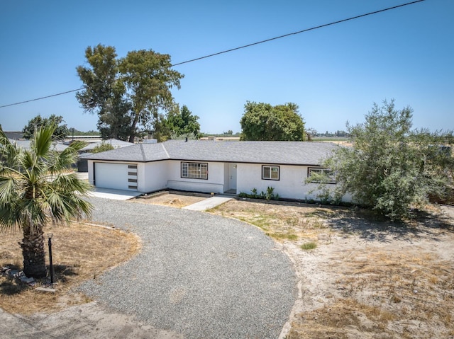 17189 Iona Ave, Lemoore, CA 93245 - ranch-style house featuring stucco siding, driveway, and an attached garage