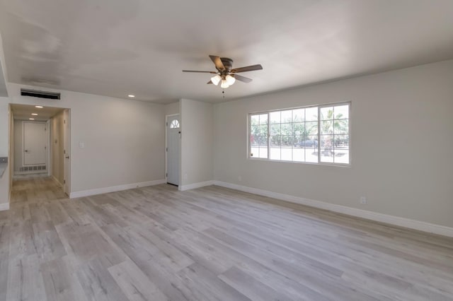 17189 Iona Ave, Lemoore, CA 93245 - empty room featuring a ceiling fan, light wood finished floors, and recessed lighting