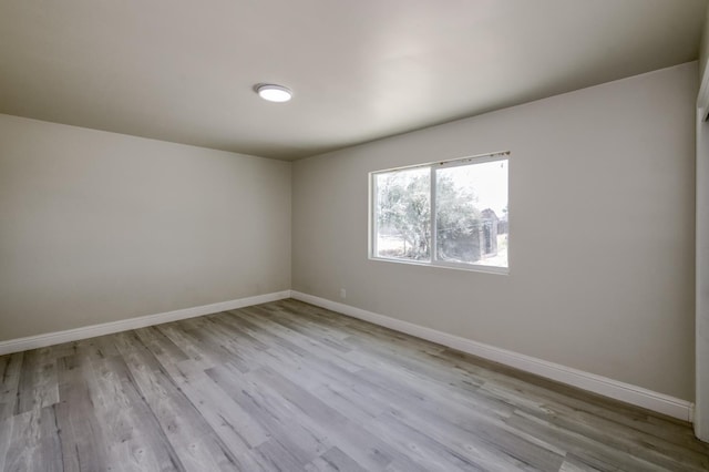 17189 Iona Ave, Lemoore, CA 93245 - spare room with baseboards and wood finished floors