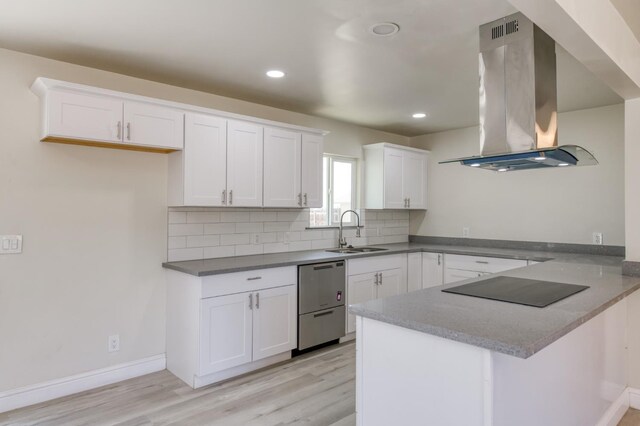 17189 Iona Ave, Lemoore, CA 93245 - kitchen with island range hood, dishwasher, black electric stovetop, a peninsula, and light wood-type flooring