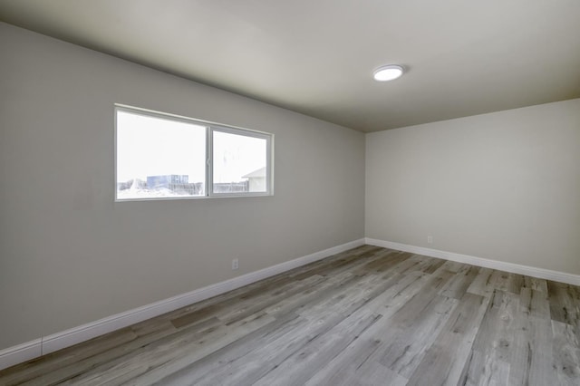 17189 Iona Ave, Lemoore, CA 93245 - empty room featuring light wood-style floors and baseboards