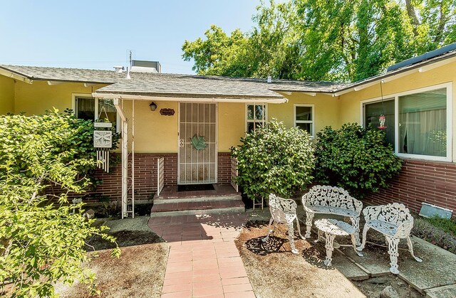 5432 E Swift Ave, Fresno, CA 93727 - view of exterior entry with brick siding and stucco siding