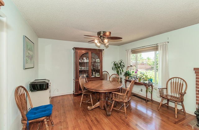 5432 E Swift Ave, Fresno, CA 93727 - dining space with wood finished floors, ceiling fan, and a textured ceiling