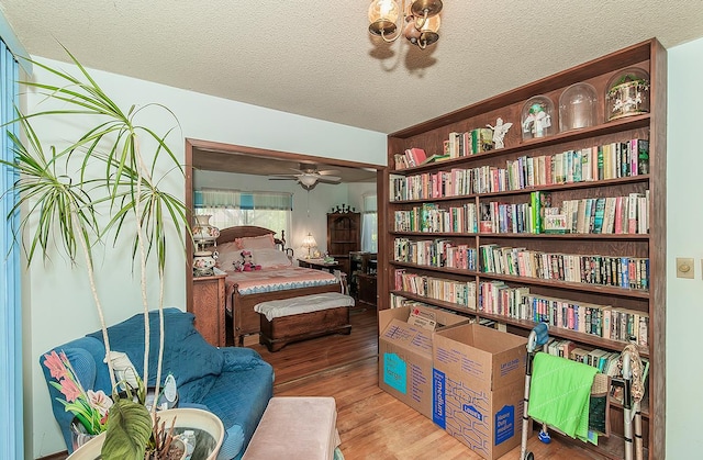 5432 E Swift Ave, Fresno, CA 93727 - bedroom with wood finished floors and a textured ceiling