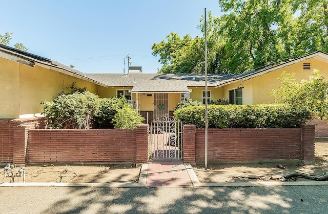 5432 E Swift Ave, Fresno, CA 93727 - view of front of home featuring a gate and stucco siding